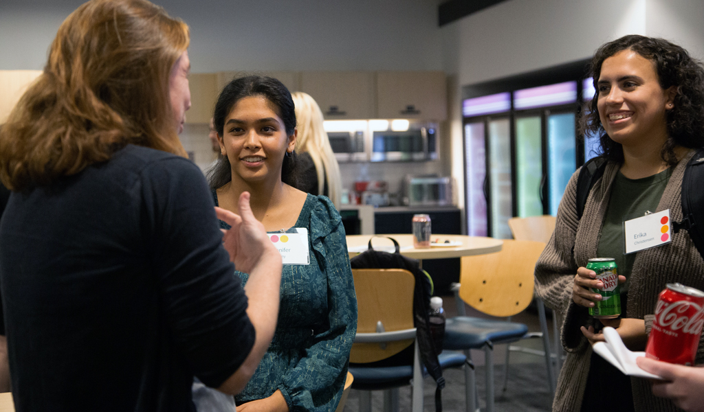 VHB team members mingle at a company event.