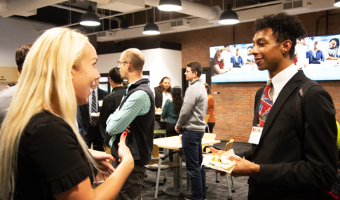 VHB team members chat with Northeastern University students.