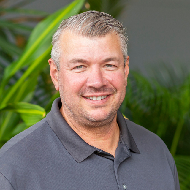 Darren Bickford in a gray polo shirt.