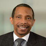 Headshot of Grady Smith in the office wearing a black blazer