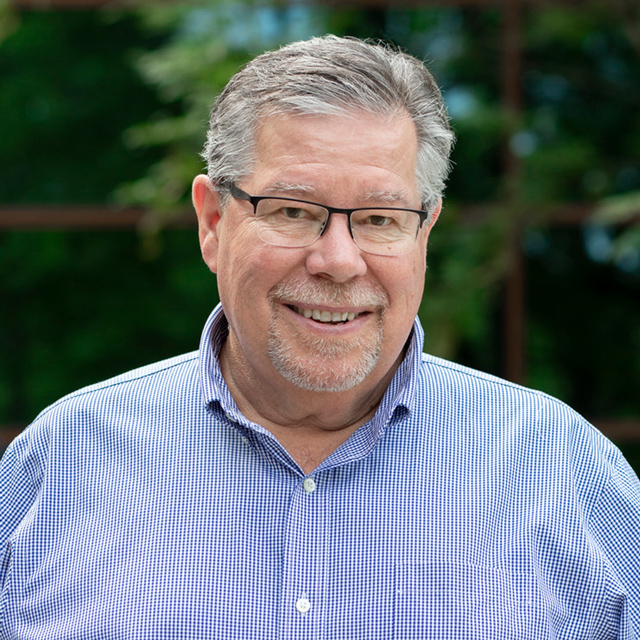 Mark Hamelin in a checkered shirt.