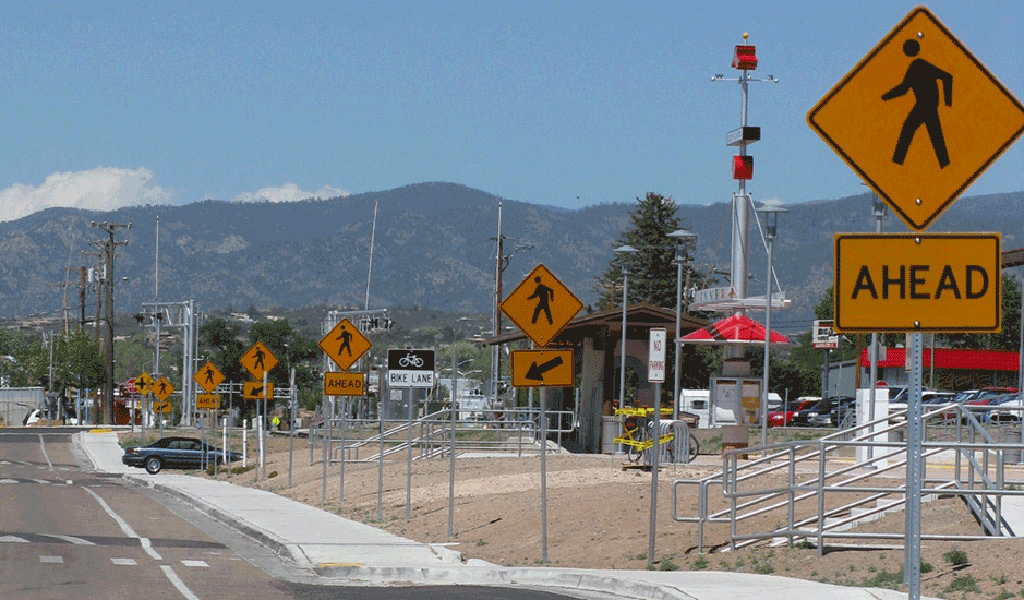 Road signs show pedestrians where it is safe to cross the street.