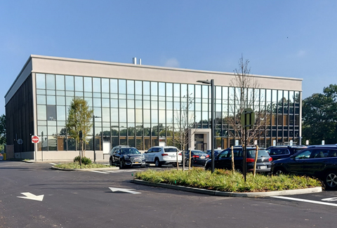 View of the new outpatient facility with landscaped parking lot and islands 