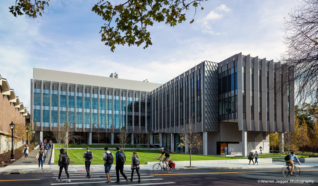 Students walk alongside the Brown University Engineering Research Center (ERC)