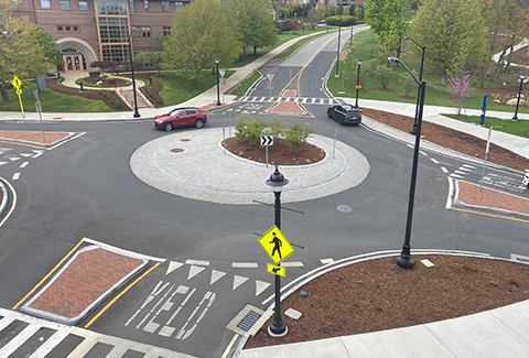 Cars driving around and exiting a roundabout