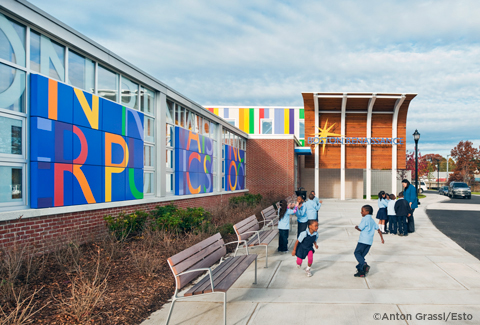 Children standing and playing in front of Boston Renaissance Charter Public School.