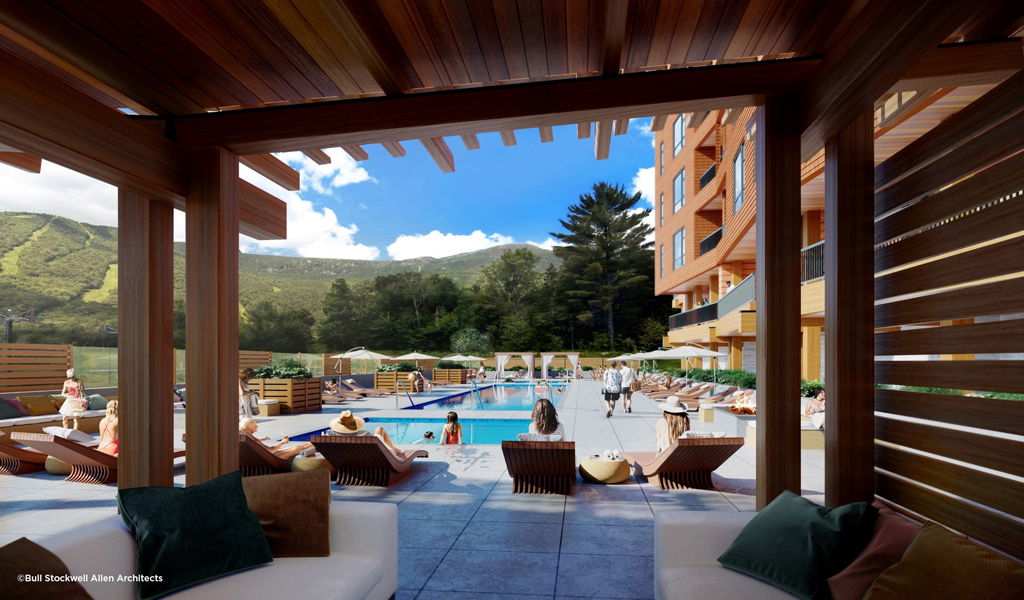 People lounge by the pool at the Aquatics Terrace at One Spruce Peak