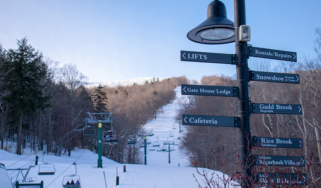 Sugarbush ski lift with wayfinding signs.