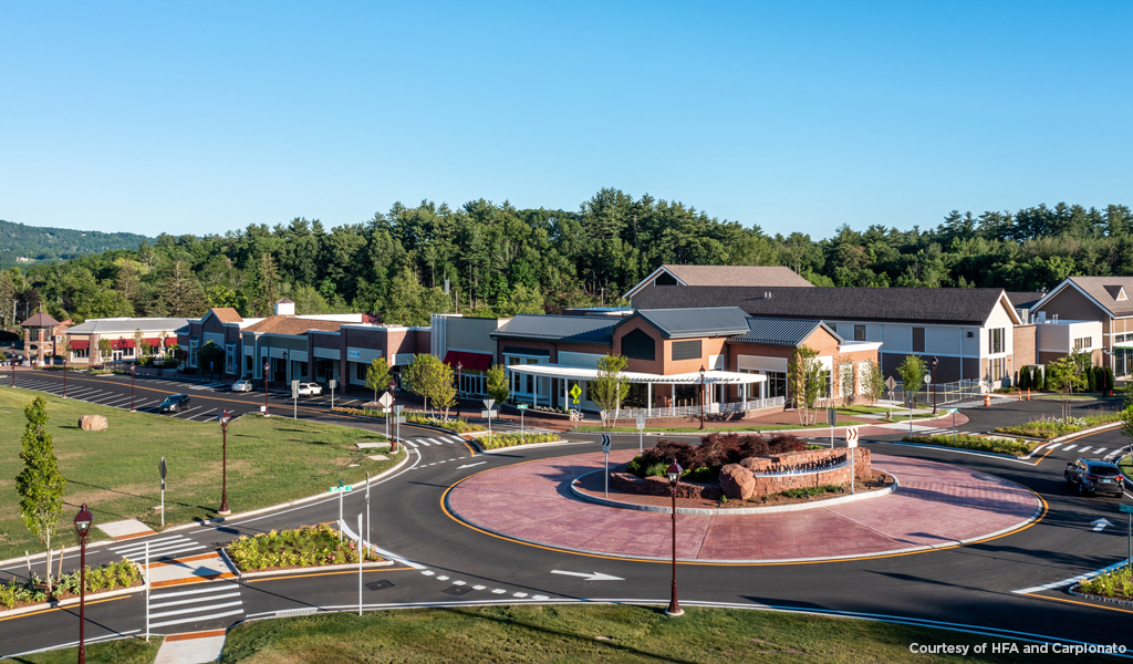 Aerial view of the newly constructed Avon Village Center buildings, roadways, roundabout, and parking areas.