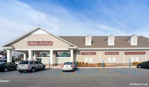 Exterior side view of a modern CVS/pharmacy location.