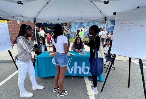 VHB staff engage with members of the Randolph, MA community at an outdoor event.