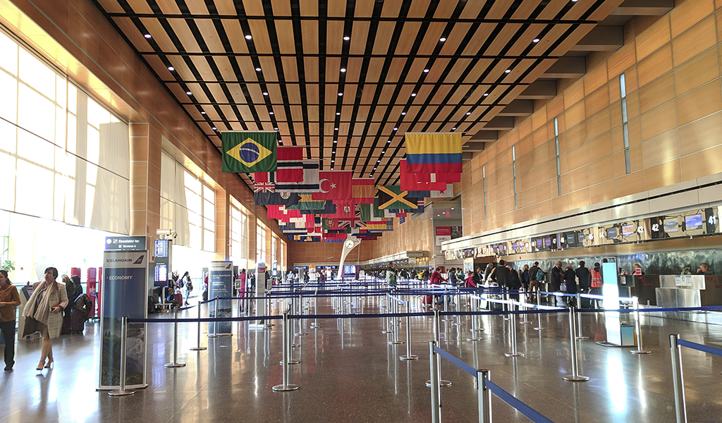 Passengers check in for their flights at Boston-Logan International Airport.