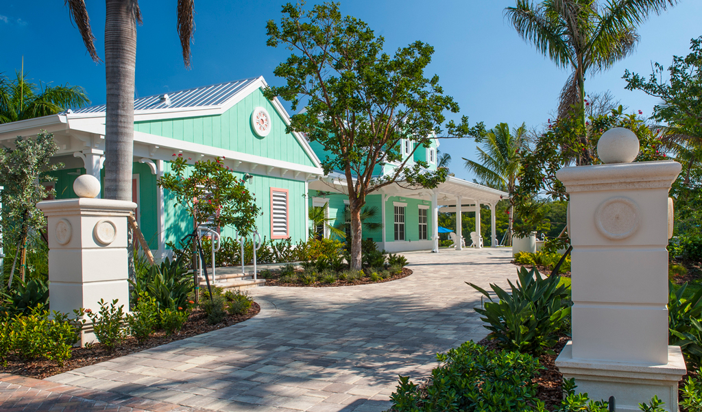 Entrance dock to the master building, lined with palm trees.