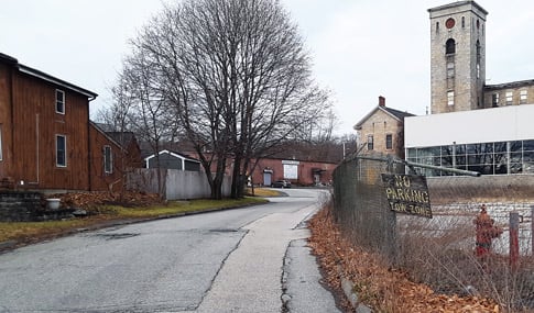 Stevens Mill’s dilapidated parking lot and chain-link fence.