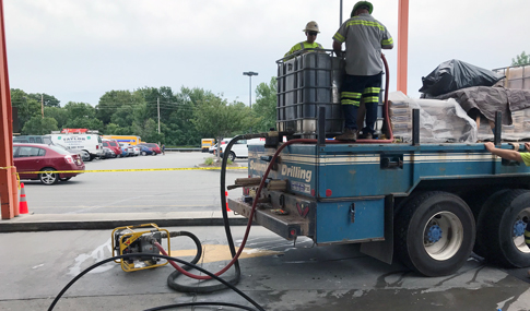 Licensed drillers injecting grout during sealing of former production wells.