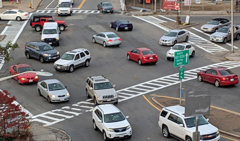 Kelley Square’s original intersection lacked clean alignments, a defined traffic pattern, and wayfinding signage.