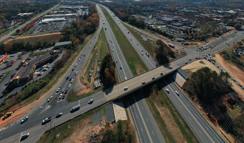 Construction of the existing diverging interchange over I-77. 