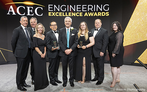 VHB employees stand with ACEC award