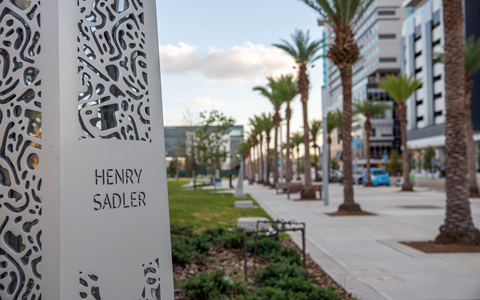 A Luminary Green Park Memorial with a patterned façade and the name Henry Sadler