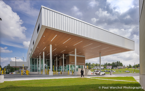 The exterior of a modern building with angled roofline.