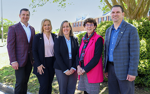 Karen McPherson (center) stands with VHB’s I-64 leadership for a group photo.