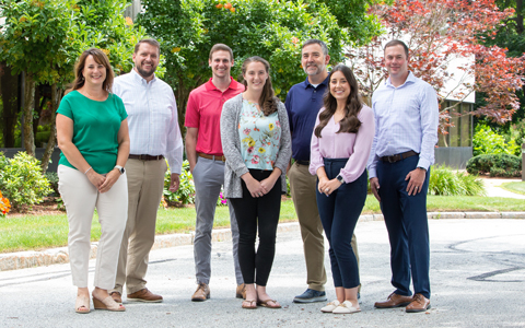 7 VHBers from the New Hampshire office pose for a picture.