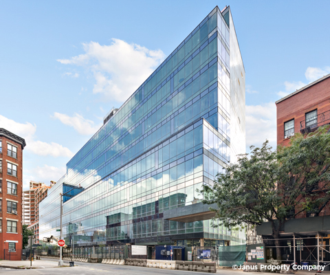 Glass building seen from the street level.