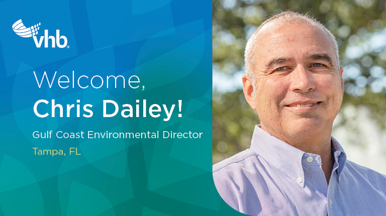 Chris Dailey wears a blue shirt in an outdoor setting.