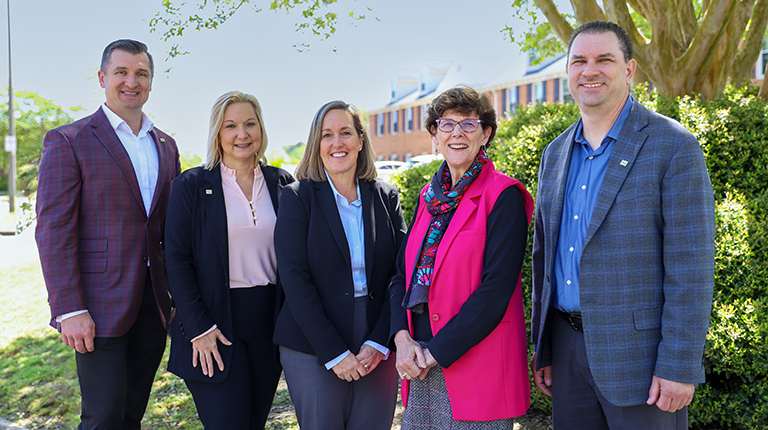 Karen McPherson (center) stands with VHB’s I-64 leadership for a group photo.