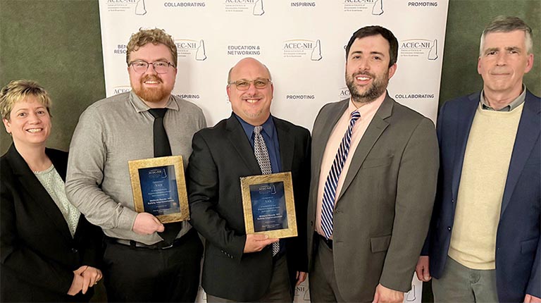 Award winners smiling at the camera