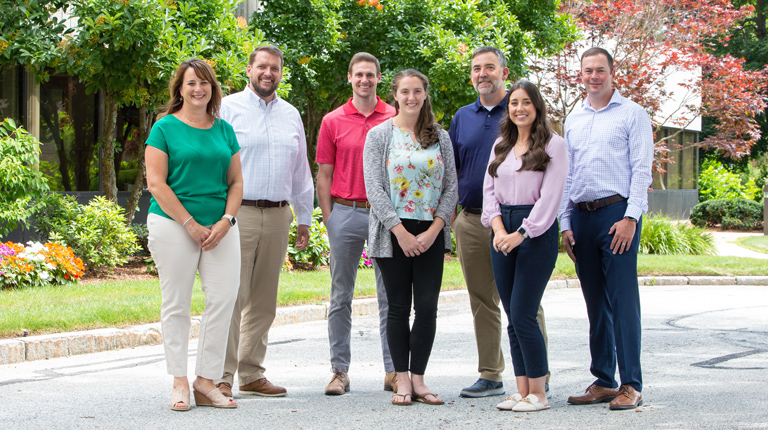 7 VHBers from the New Hampshire office pose for a picture.