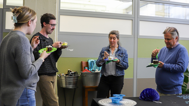 Four Richmond VHBers gather to eat cake as part of the celebration.