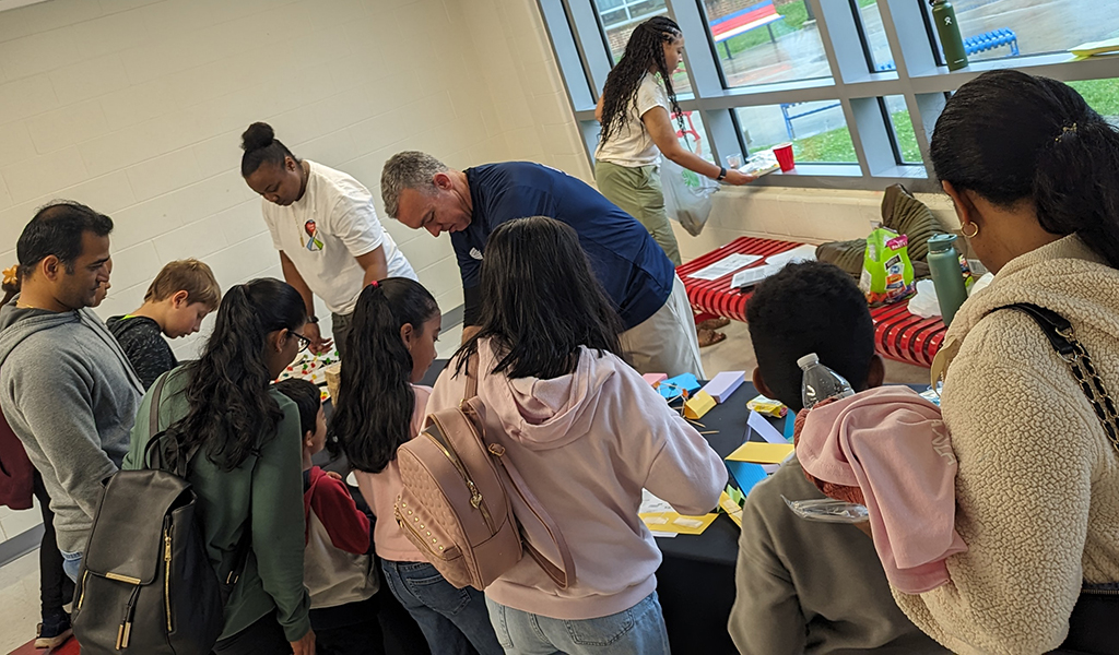 Joe Wanat volunteers with students.