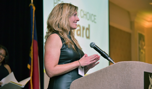 Candice Andre giving an acceptance speech at the ACEC/NC Awards Gala.