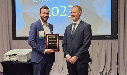 Charlie Townsend on stage accepting an award at the PENC awards ceremony.