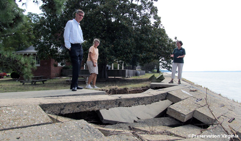 People observe the Hurricane Irene damage to Jamestown’s 1901 Seawall. 