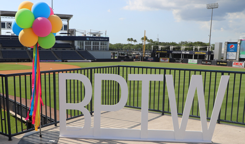 Colorful balloons and the sign for BPTW