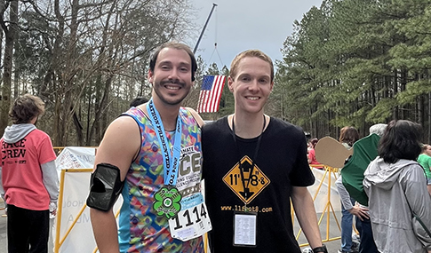 Two race participants after the race with their medals.  