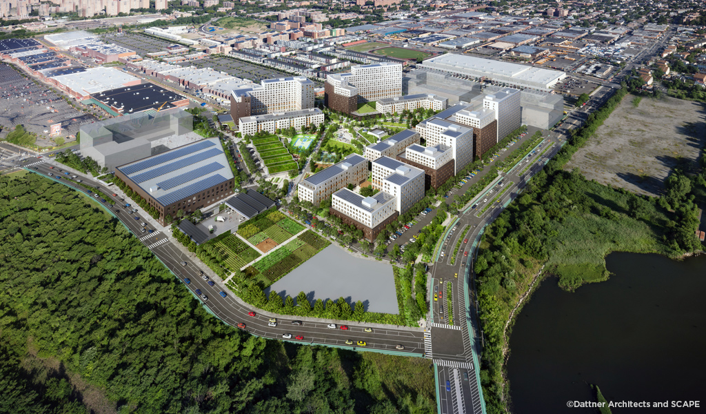 Birds-eye view of the Alafia development with buildings and greenery.