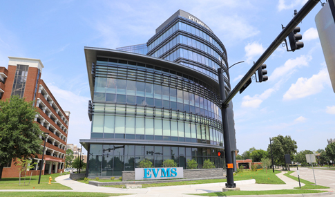 Waitzer Hall’s three-story podium with the Eastern Virginia Medical Center campus sign