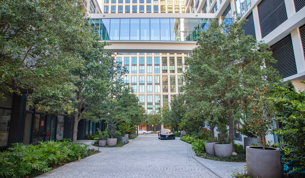 A covered walkway over an urban downtown street.