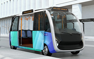 Self-driving shuttle bus waiting at bus station. The bus station equipped with solar panels for electric power.