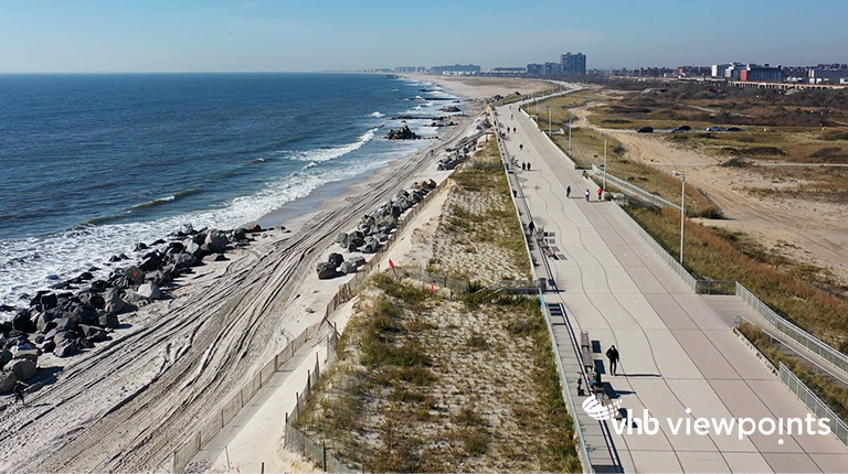 Aerial view of a beach and walkway.