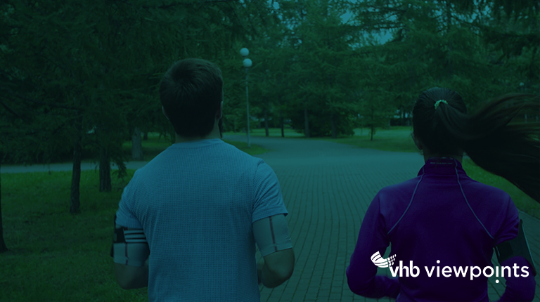 Two people jogging in a park