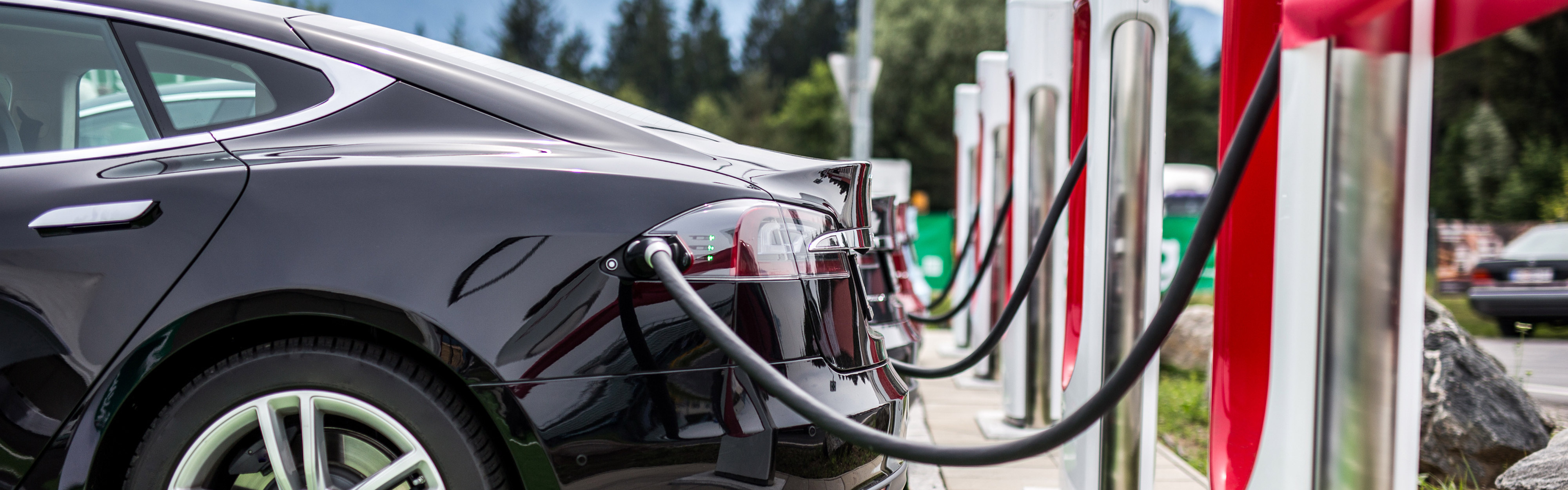 An electric vehicle plugged into a charging station.