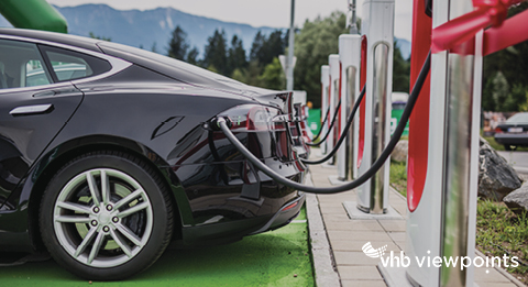 An electric vehicle plugged into a charging station.