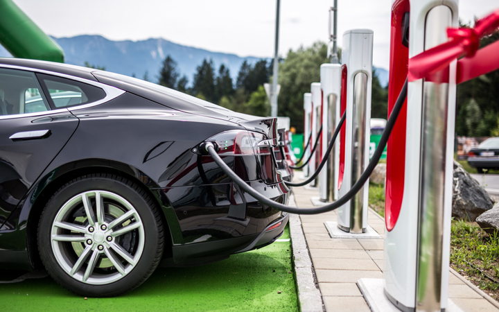 An electric vehicle plugged into a charging station.